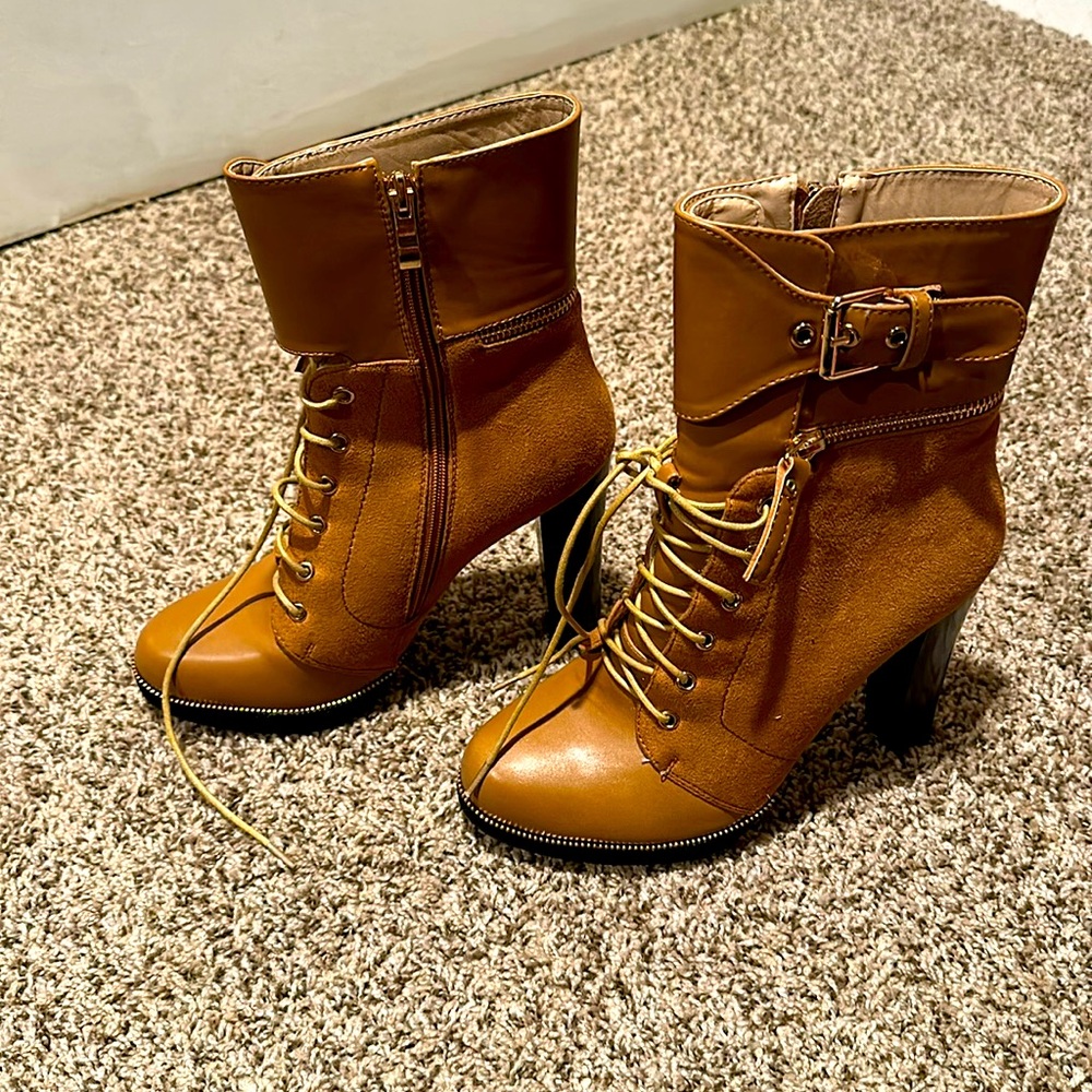 Like new, Laced boots, perfect for game day or sporting events.